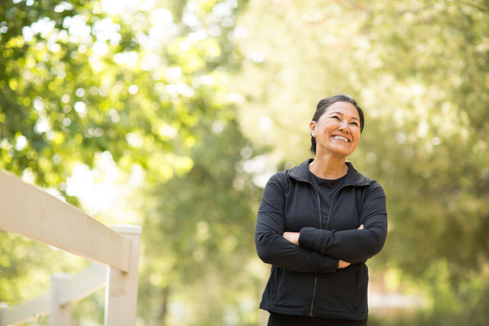 Fit Asian woman exercising and walking outside