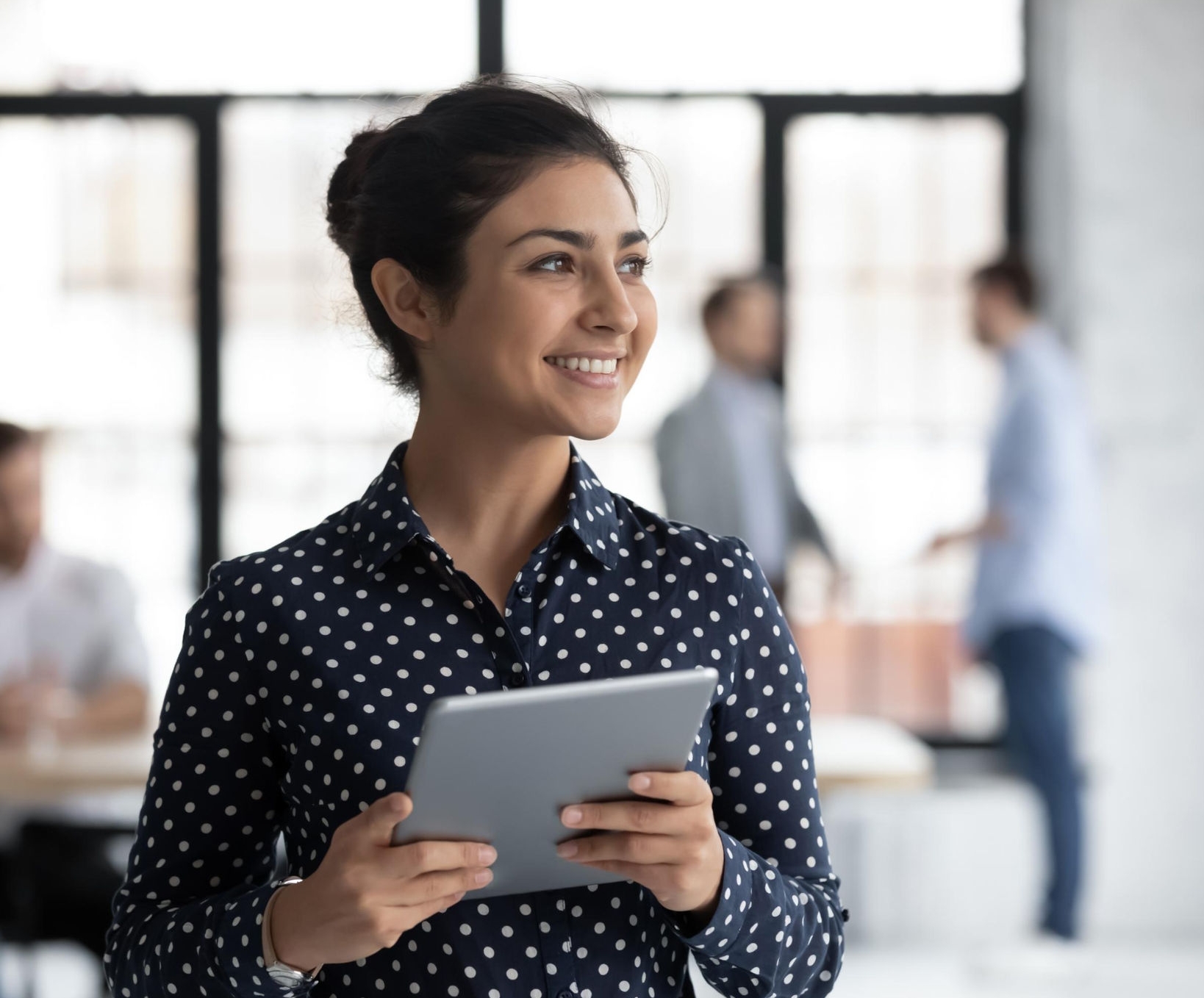 canva-young-woman-employee-tablet-smiling