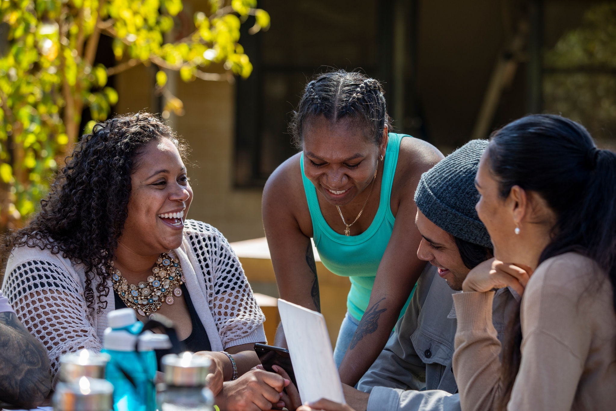 Young aboriginal students together outdoors in the sun in Australia.