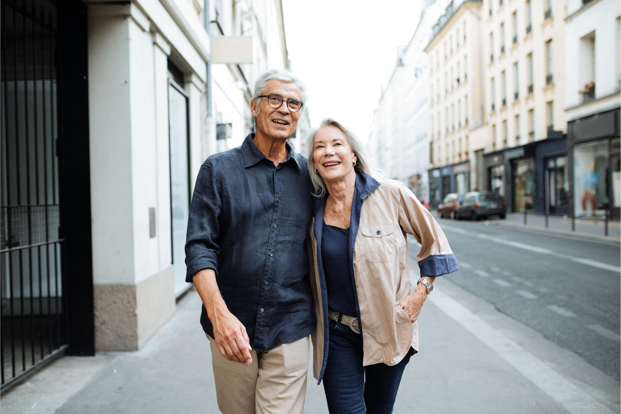 canva-happy-couple-retirement-walking-street