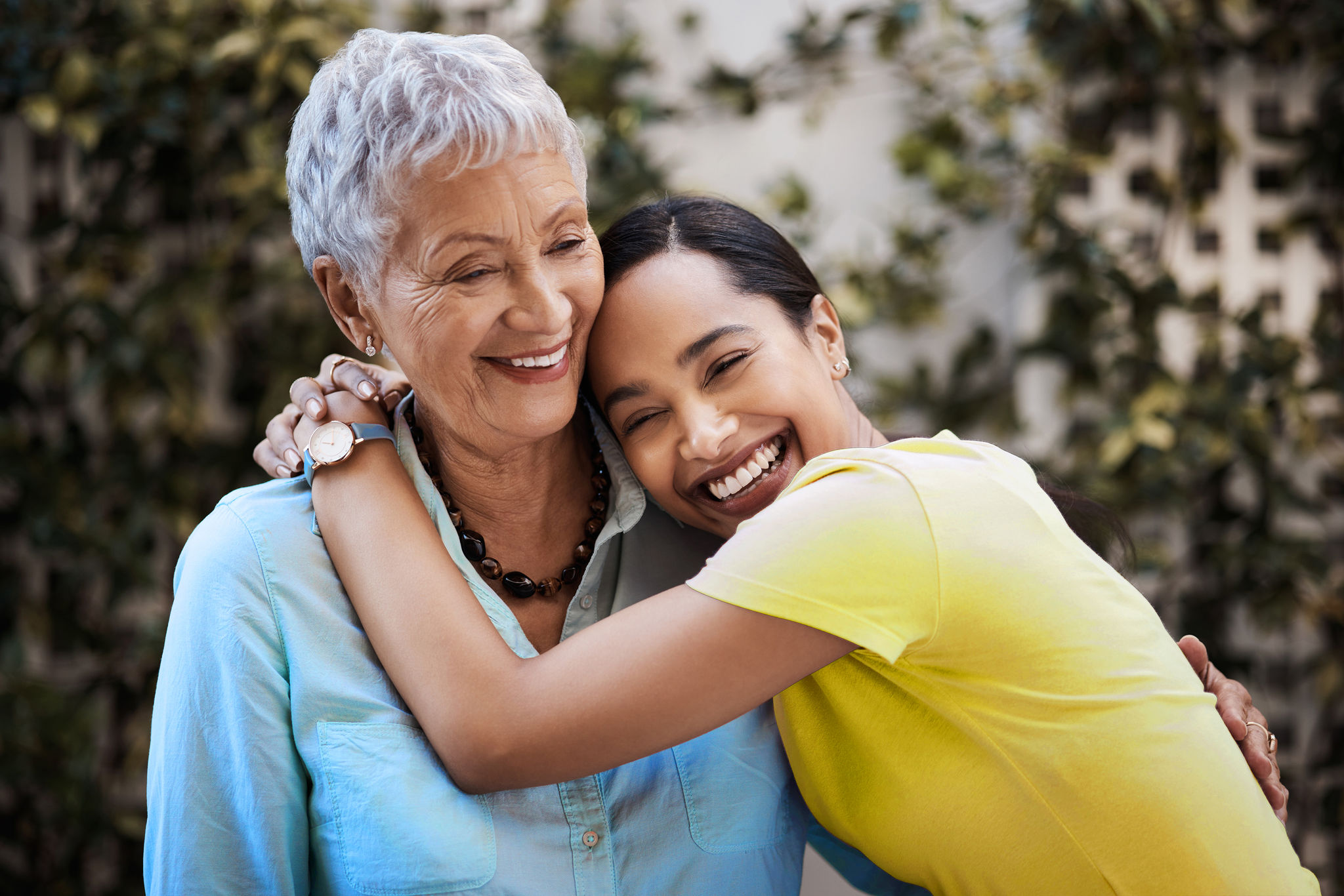 Happy, hug and portrait of a mother and woman in a garden on mothers day with love and gratitude. Smile, family and an adult daughter hugging a senior mom in a backyard or park for happiness