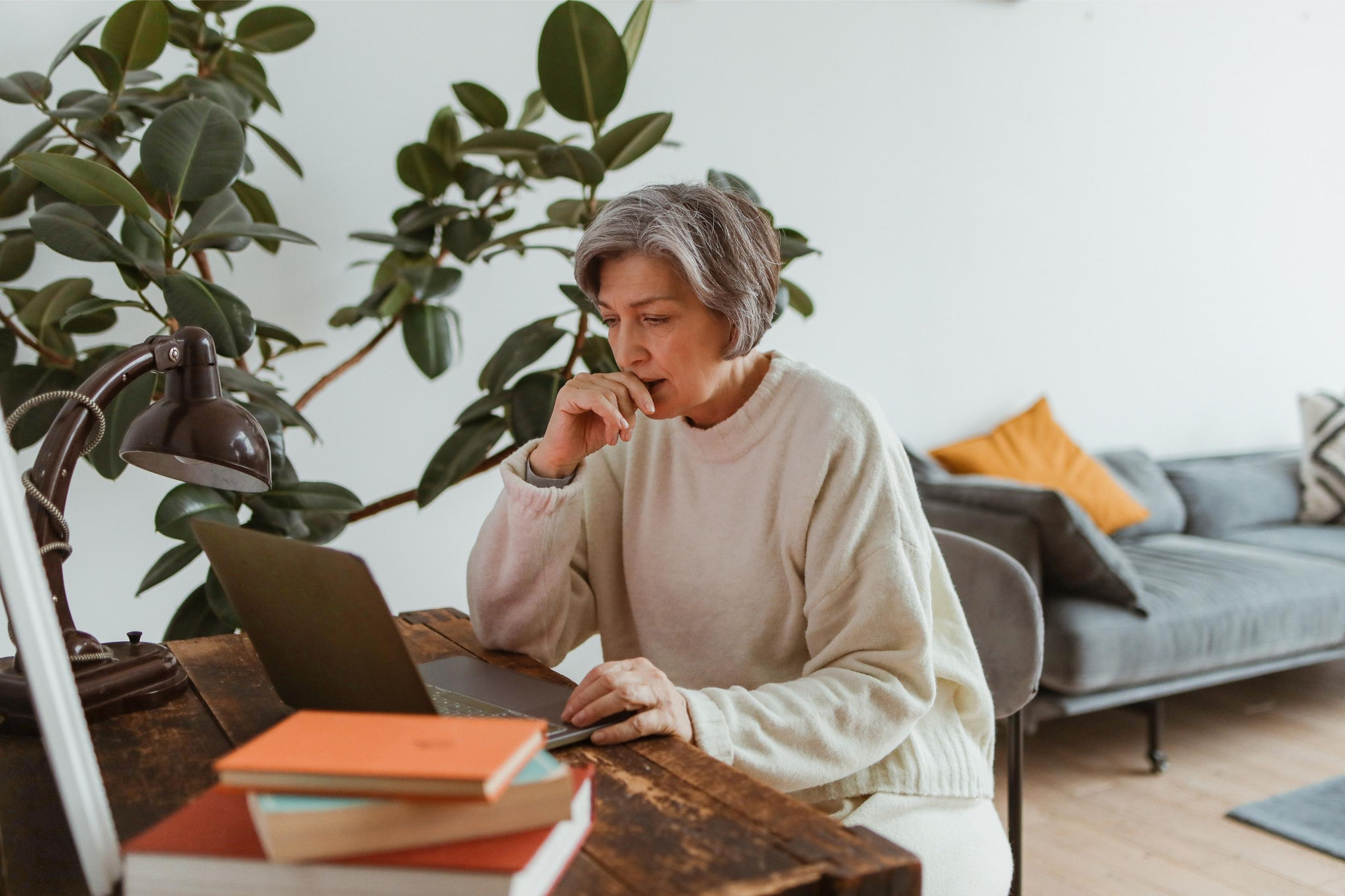 canva-senior-woman-laptop-home