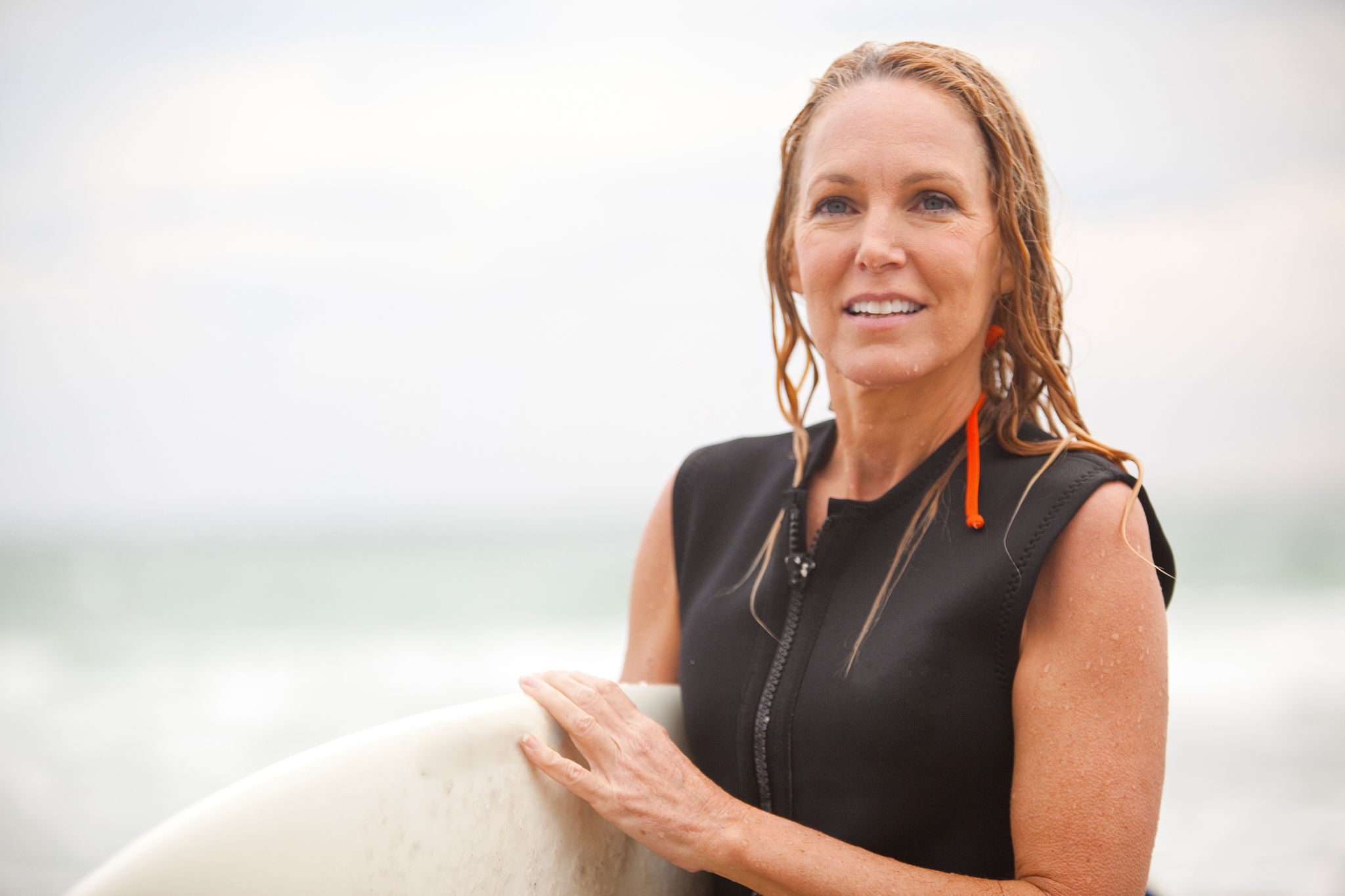 50's women surfer day at the beach