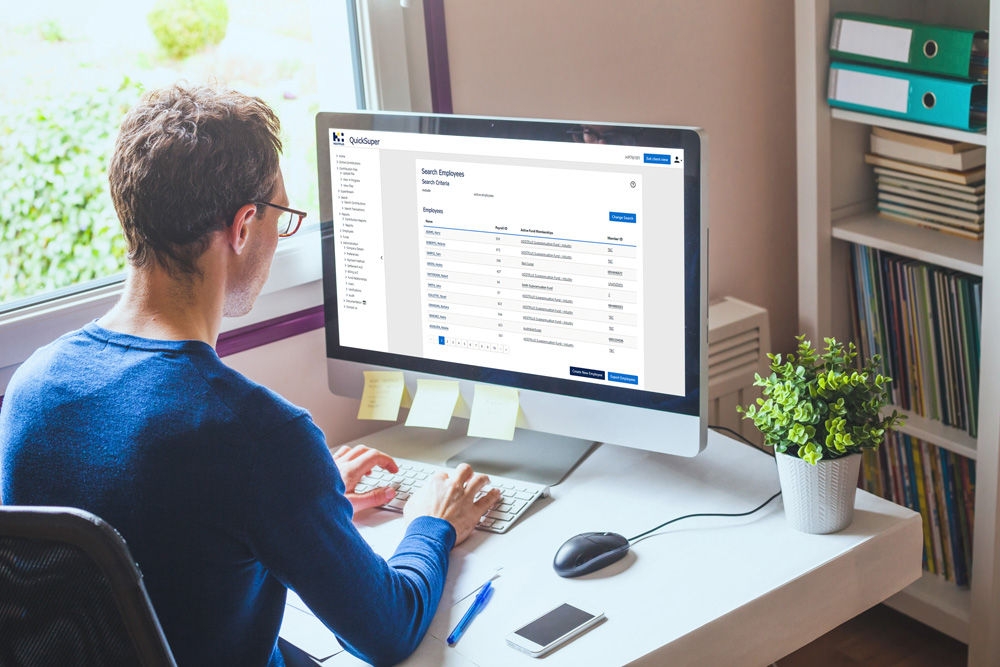 business man working on computer with empty blank screen in office workplace background