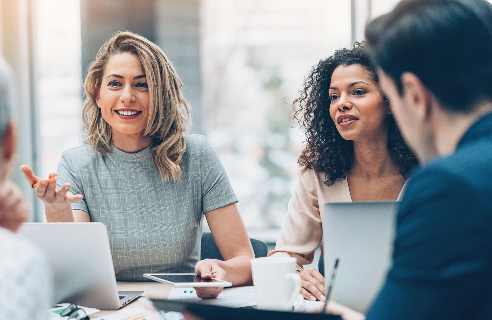 Canva-female-manager-discussing-office-meeting