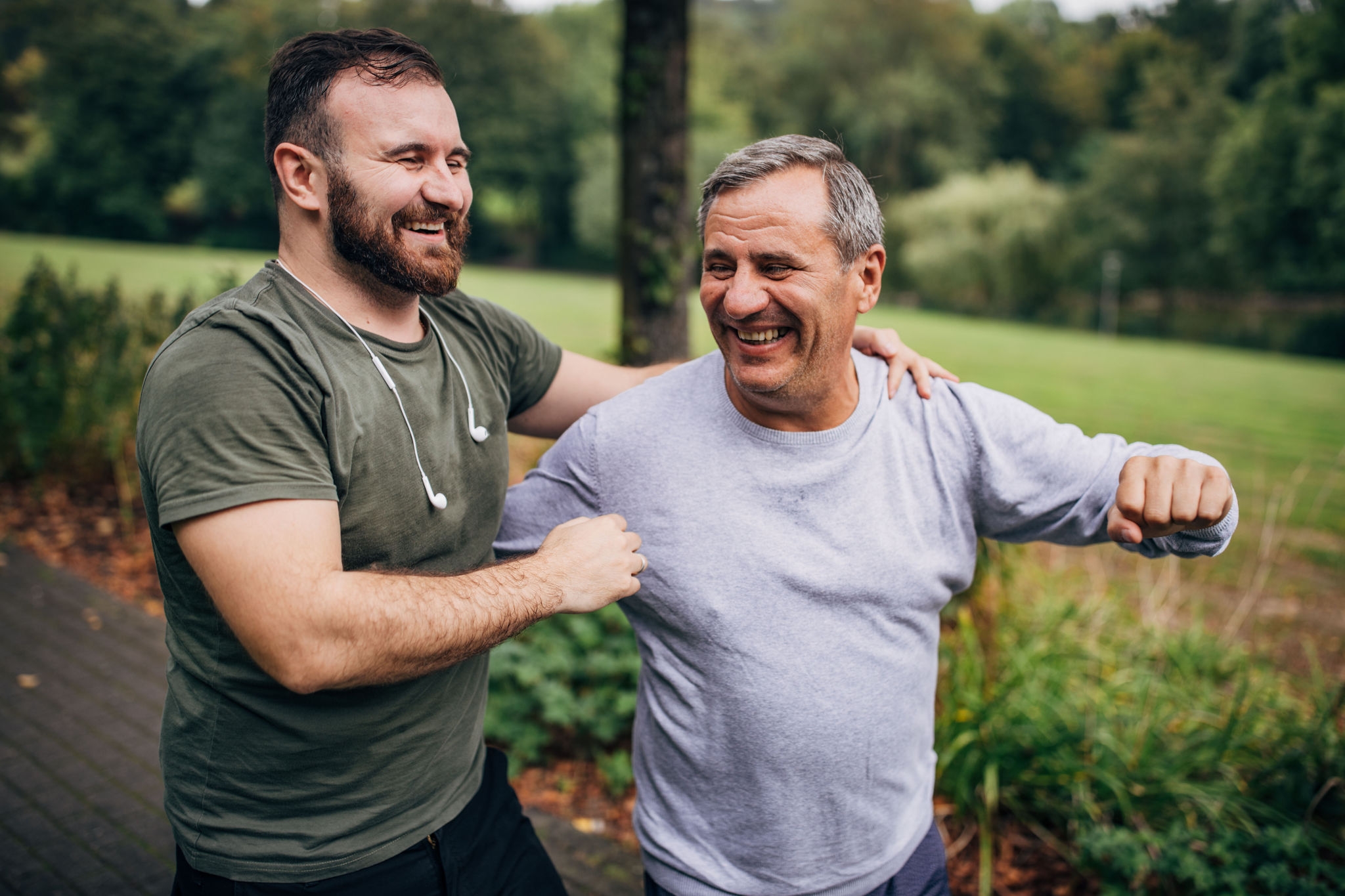 The elder father and the adult son jog