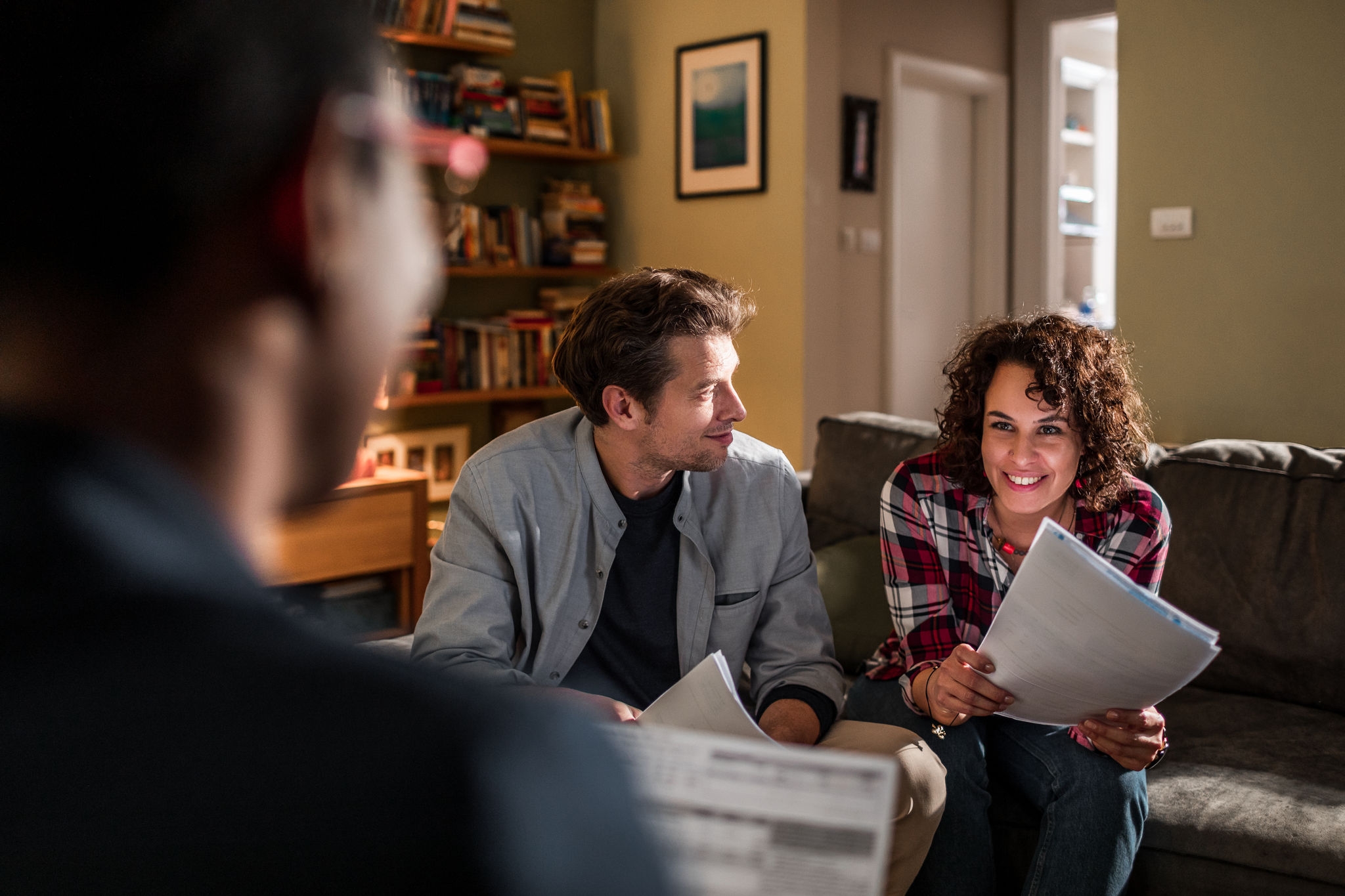 Close up of a financial advisor working with a young couple